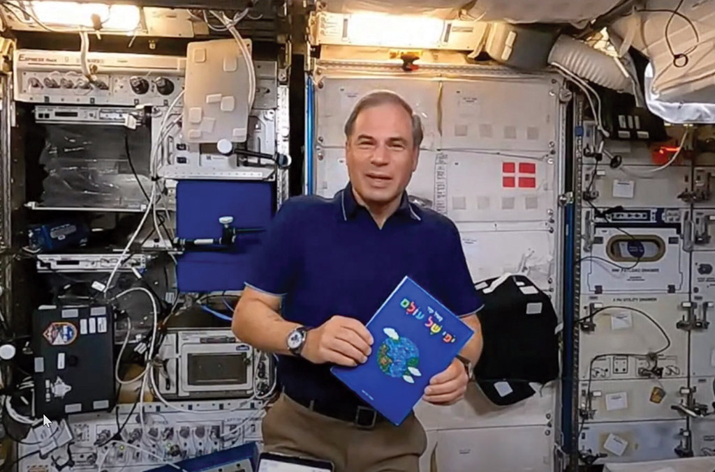 Eytan Stibbe in space with a PJ book