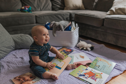 A baby with books