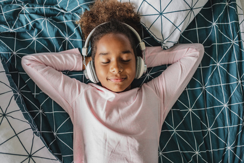 a girl listening to headphones