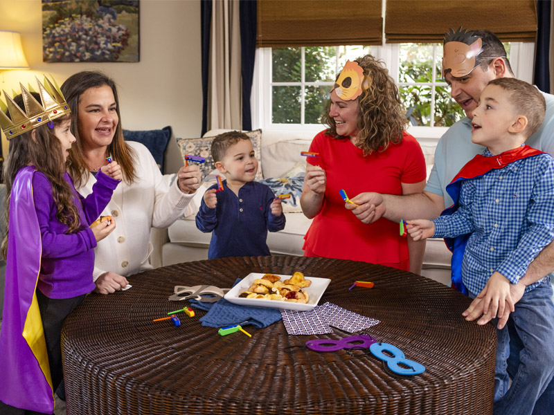 Colorful illustration of Purim favors and snacks