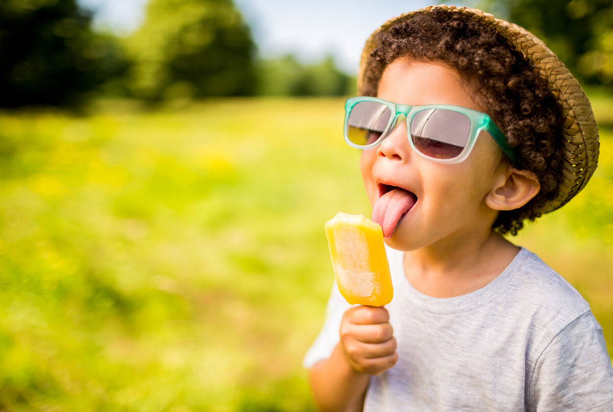Little boy enjoying summer popsicle