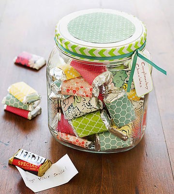 Glass jar filled with paper-wrapped chocolates