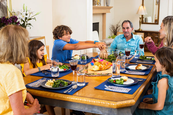A family enjoying shabbat dinner together