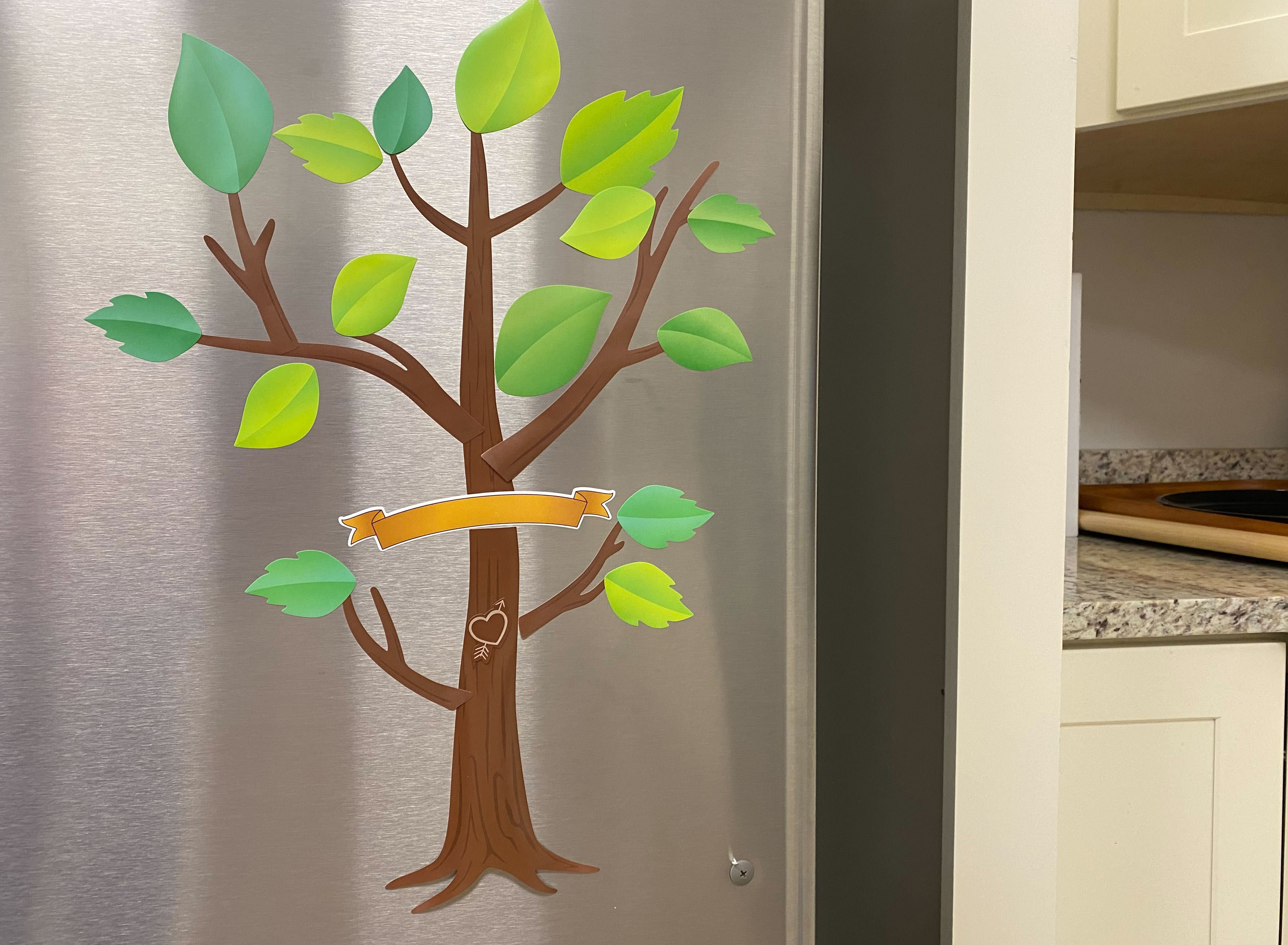 The family tree gift displayed on a refrigerator