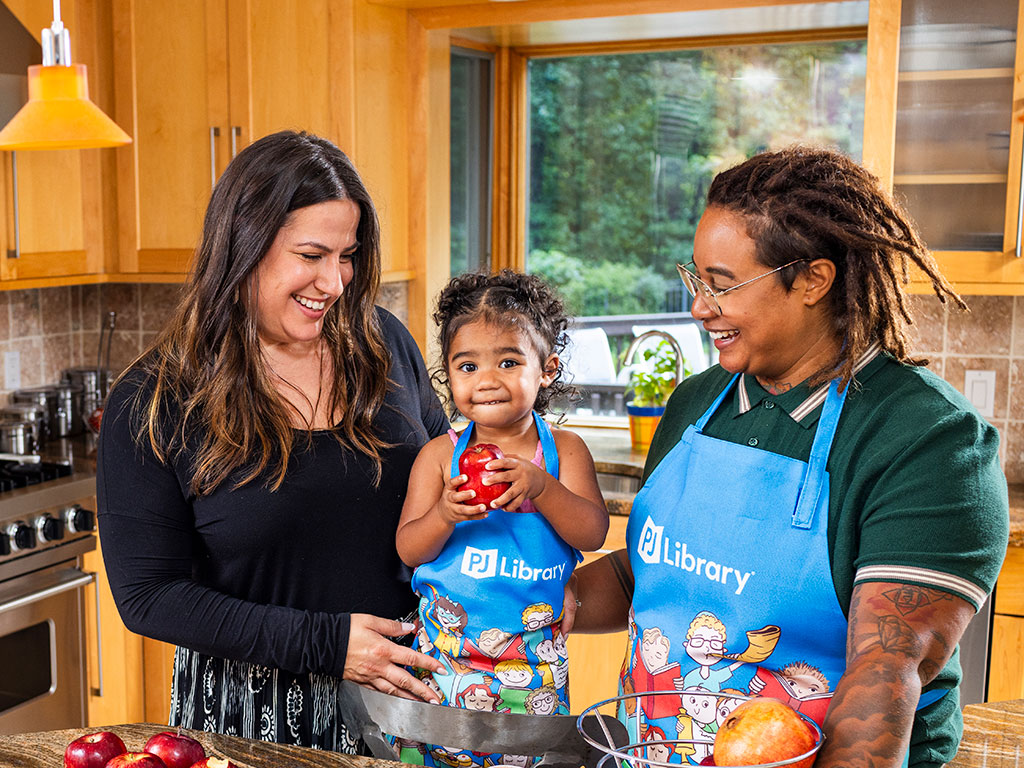 Parents and child are cooking in their kitchen