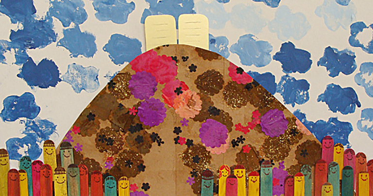 A collage of Mt. Sinai made of popsicle sticks and construction paper.