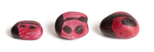 Stones painted like ladybugs