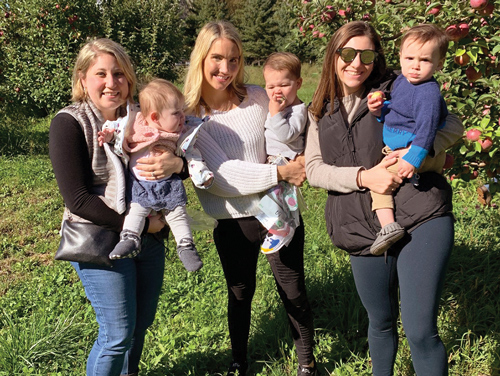 Three mothers holding children