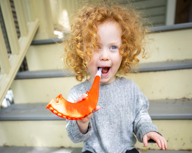 A child blowing a shofar