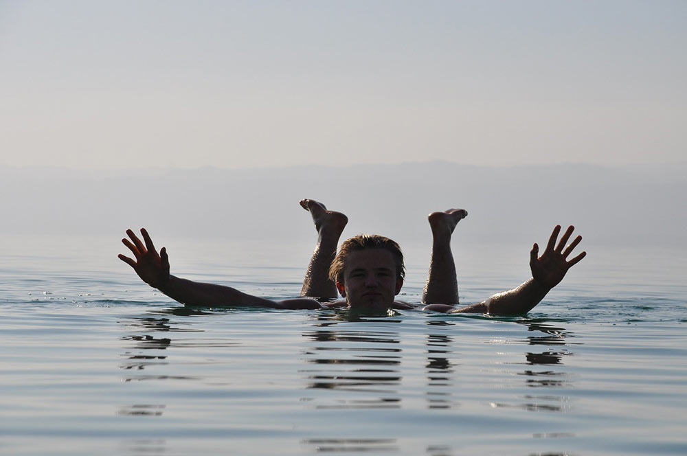 A person floating effortlessly in the Dead Sea