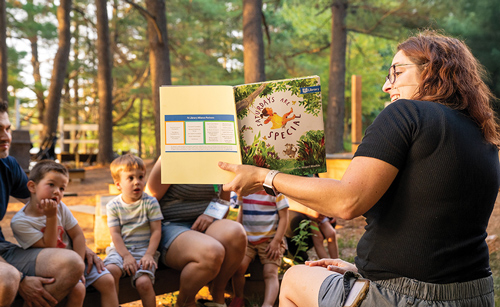 Reading to children at camp