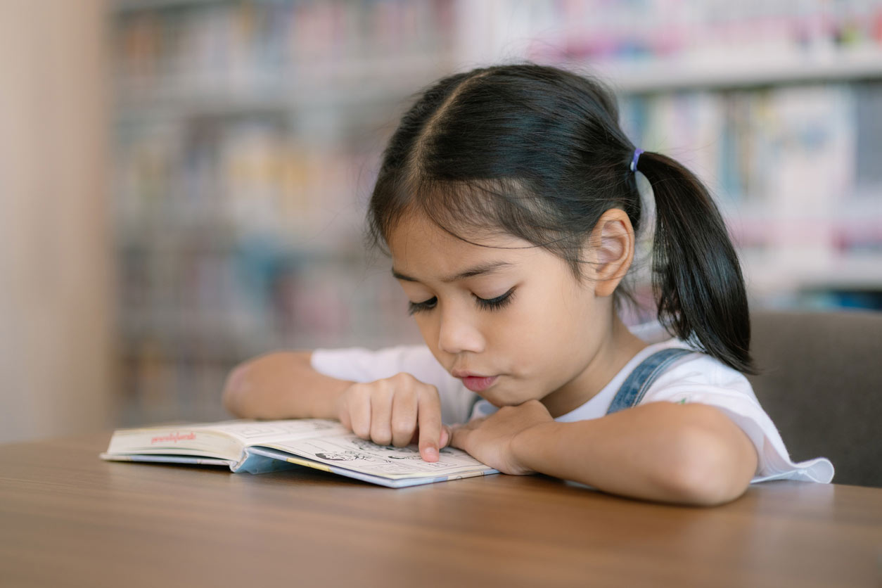 Children reading at a table