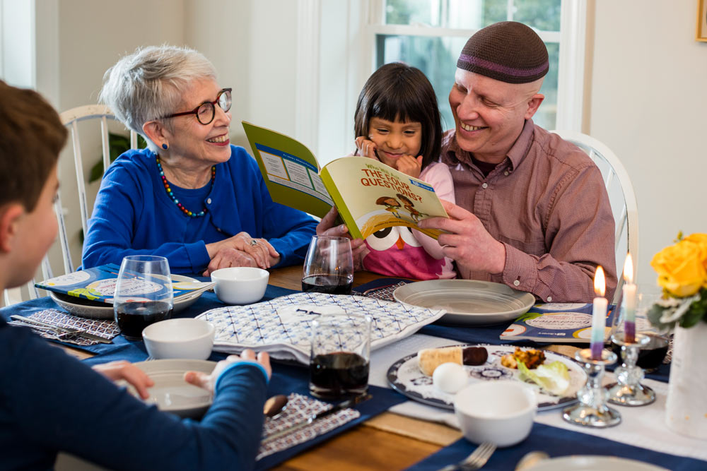 Grandparents reading to a child