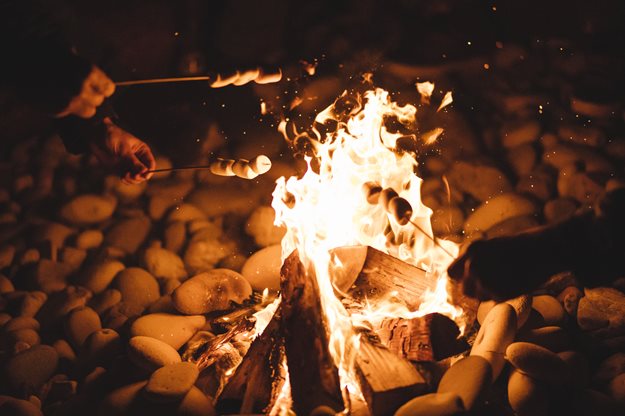 Roasting marshmallows over a bonfire