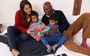 A family of four reading together