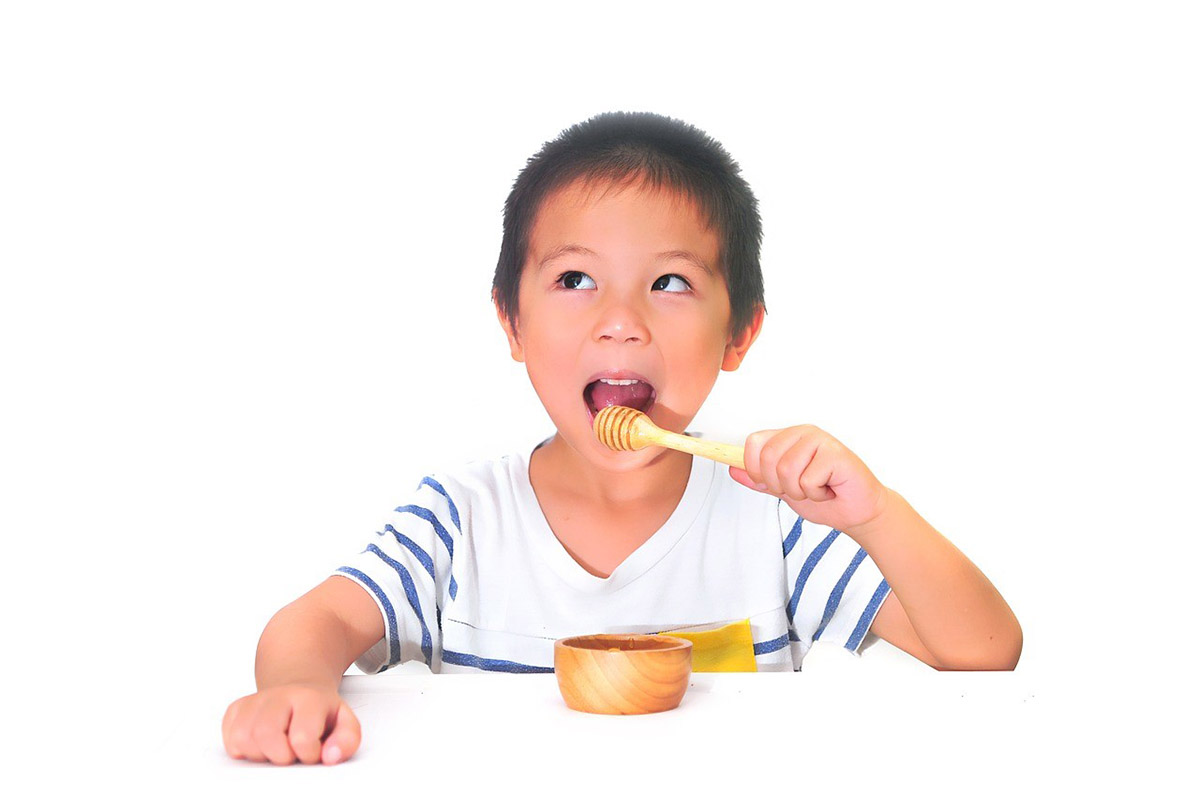 Child Eating Honey