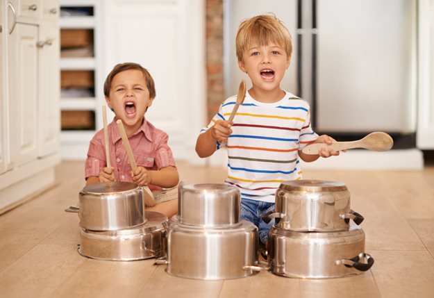 Boys playing with pots and pans